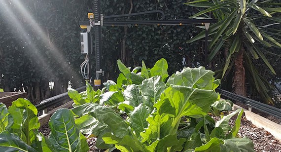 FarmBot cnc small scale farming machine used in garden
