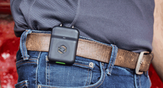 rapid overmolding Spot-r wearable device produced by Brazil Metal Parts worn by construction worker attached on belt loop.